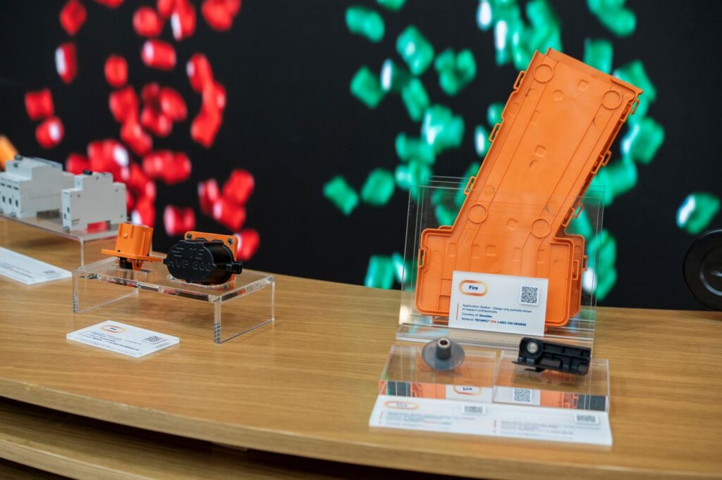 A sample of a busbar made from TECHNYL® ONE J 60X1 V30 Orange.